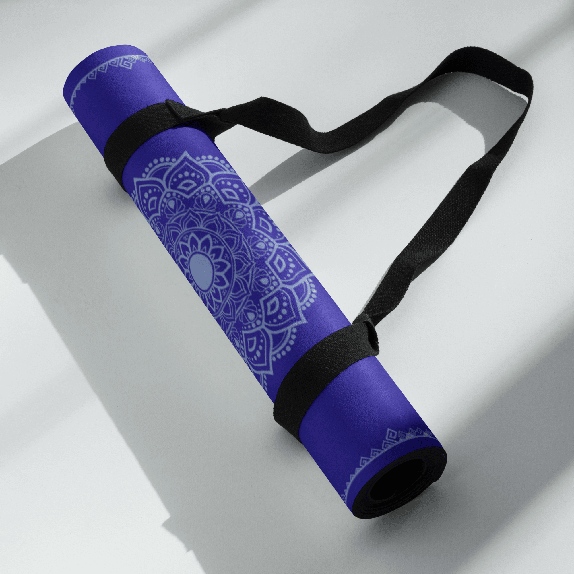 Blue Horizon Yoga Mat rolled up with a strap, best yoga mat for hot yoga featuring a stylish design.