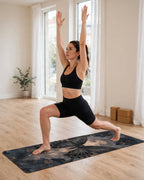 Woman in warrior pose on Hot Yoga Mat | Eclipse Wings, showcasing elegant butterfly design and non-slip surface.