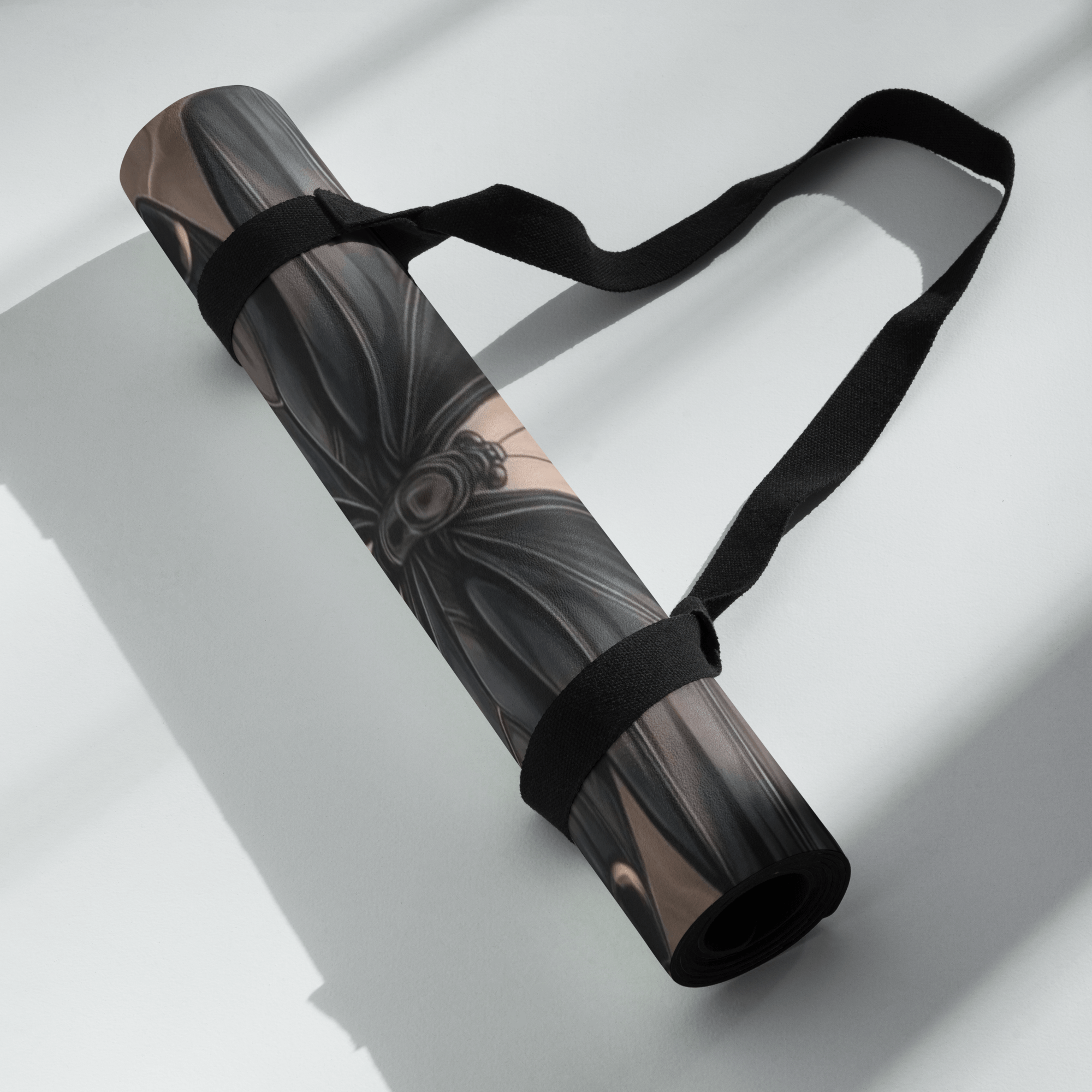 Hot Yoga Mat - Eclipse Wings | MIYRA rolled up with strap, showcasing stylish design and portability.