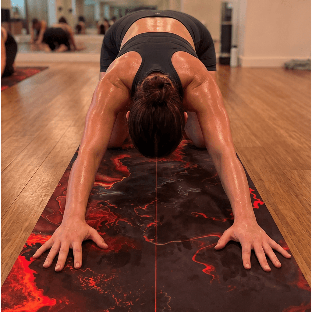 Practicing on the Hot Yoga Mat - Obsidian Flame | MIYRA®, featuring sweat-activated grip and non-slip performance.