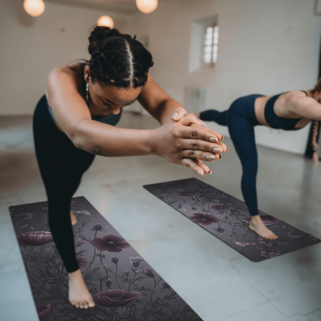 Hot Yoga Mat - Rose Mist Flow | MIYRA in a yoga studio with two women practicing yoga.
