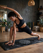 Woman practicing yoga on Hot Yoga Mat - Celestial Eye, showcasing flexibility and style in a modern studio.