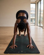 Person practicing yoga on the Best Yoga Mat For Hot Yoga, showcasing superior grip and cushioning.
