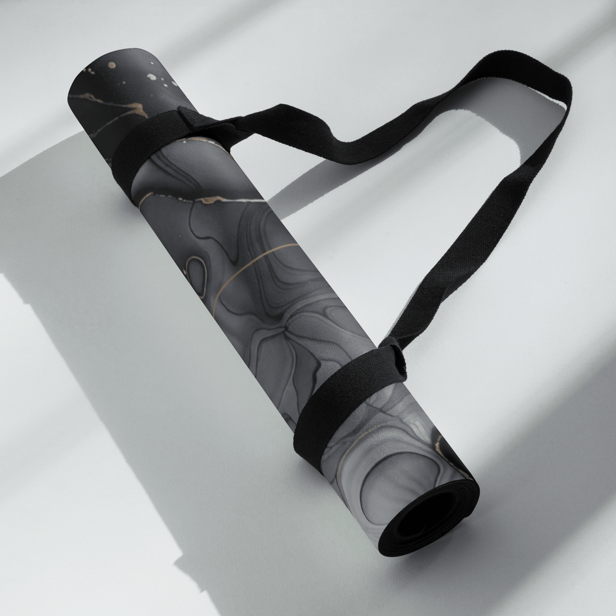 Rolled Hot Yoga Mat | Onyx Flow with stylish black strap, featuring a modern gray color pattern.