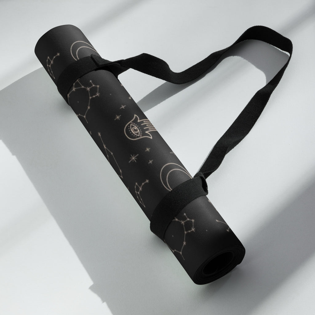 Best yoga mat for hot yoga non slip hot yoga mat rolled up with cosmic design and carrying strap.